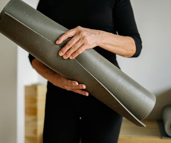 Person holding a challenging yoga pose, demonstrating strength.
